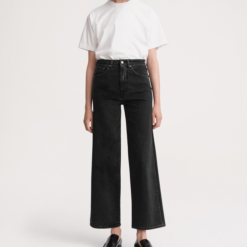 Toteme flare jeans in dark grey/washed out black